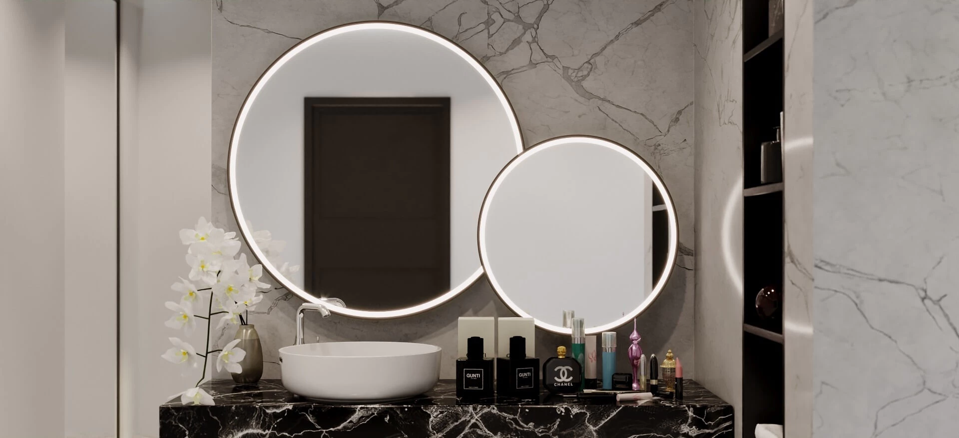Marble walls and a sink with two round-lit mirrors above a white washbowl and beauty cosmetics.