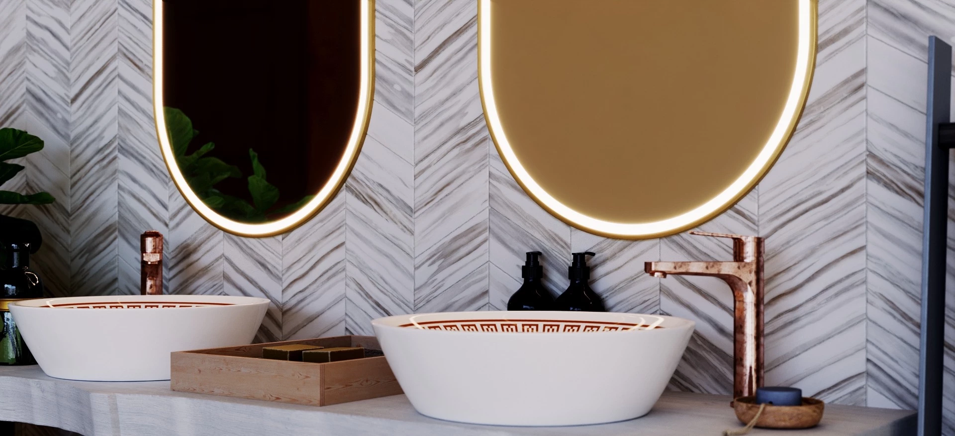 Bathroom featuring a pair of white washbowl sinks and gold-framed LED mirrors.